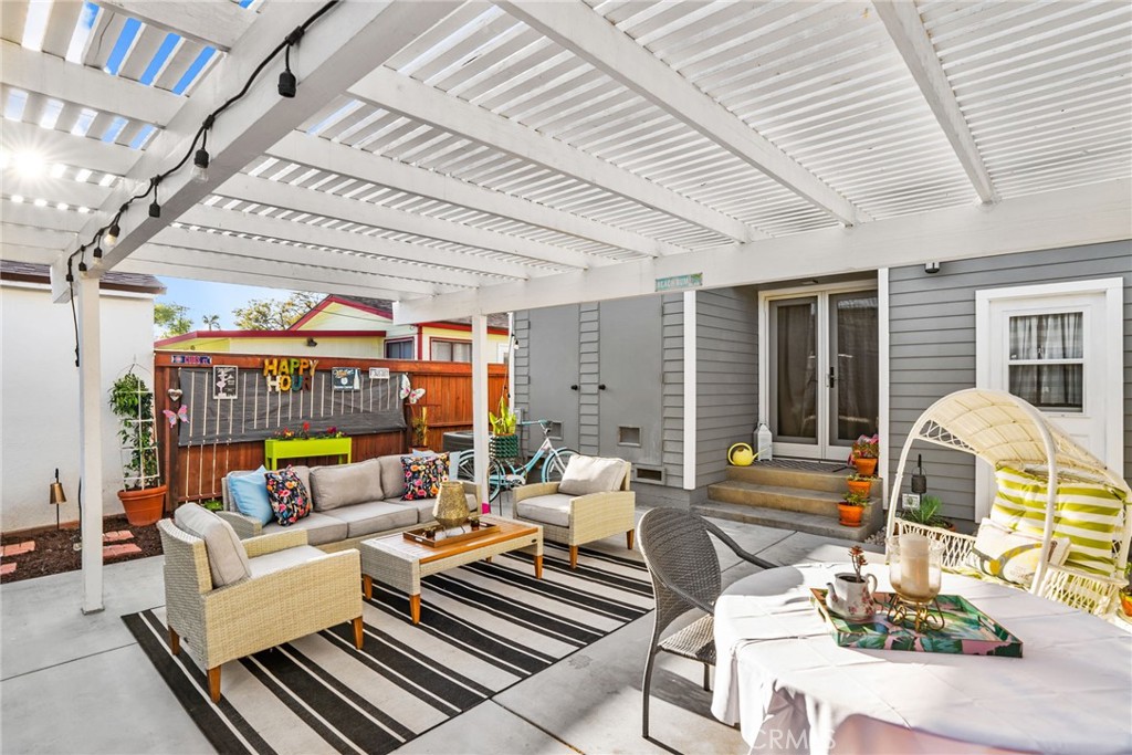 426 Jacaranda Place, Unit A Fullerton, CA 92832 - Photo 24 of 41 a living room with furniture and a chandelier