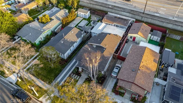 an aerial view of a residential apartment building with a yard