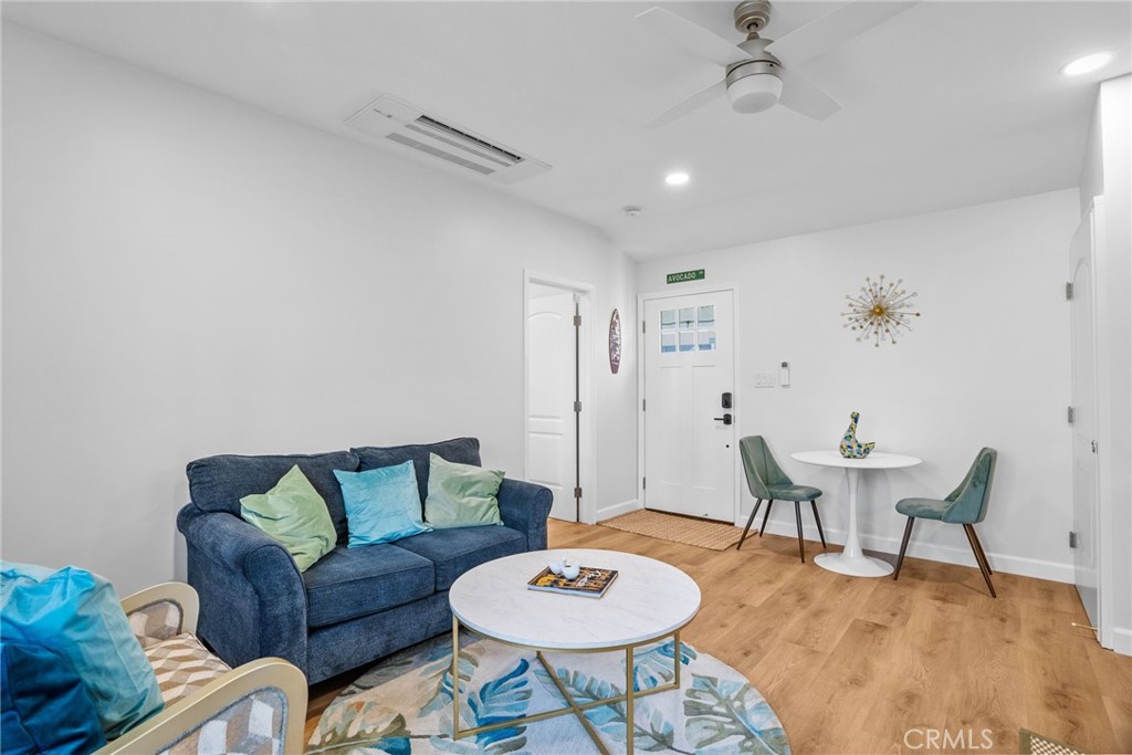 426 Jacaranda Place, Unit A Fullerton, CA 92832 - Photo 6 of 41 a living room with furniture and a wooden floor