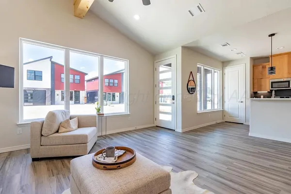 a living room with furniture and a table
