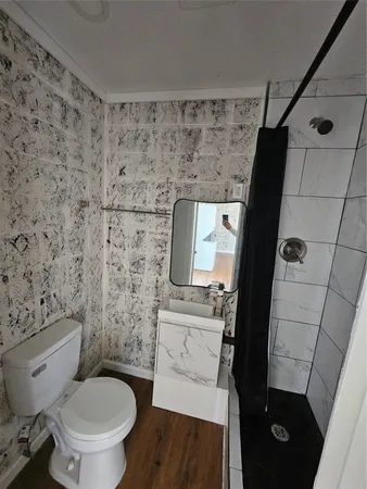 a bathroom with a toilet and a sink