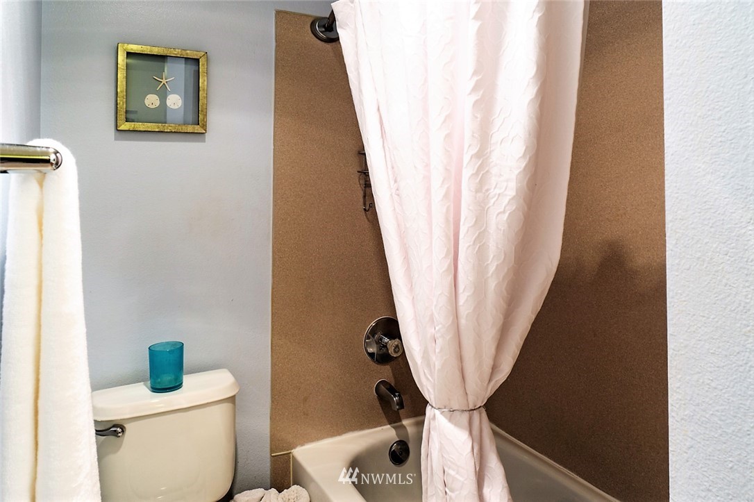 3918 243rd Place Southeast, Unit F304 Bothell, WA 98021 - Photo 12 of 25 a bathroom with a sink and a toilet