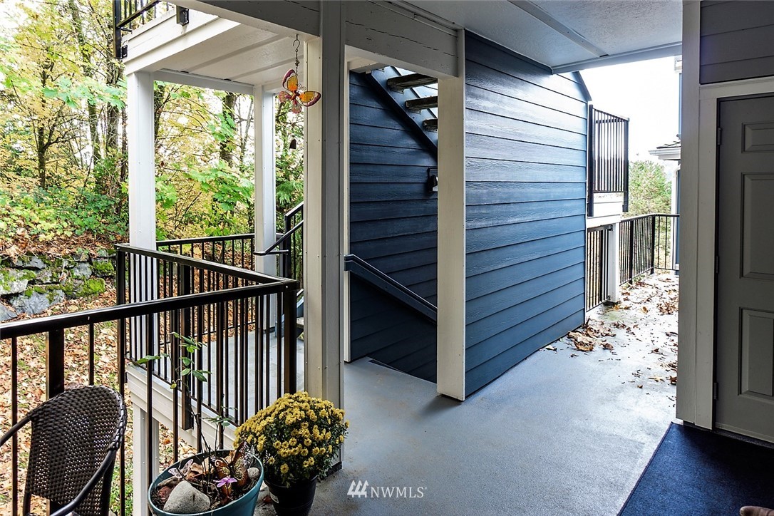 3918 243rd Place Southeast, Unit F304 Bothell, WA 98021 - Photo 19 of 25 a view of a porch with wooden floor