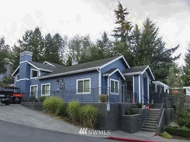 3918 243rd Place Southeast, Unit F304 Bothell, WA 98021 - Photo 21 of 25 a front view of a house with a garden