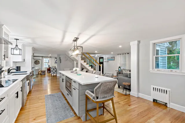 a large kitchen with a table and chairs