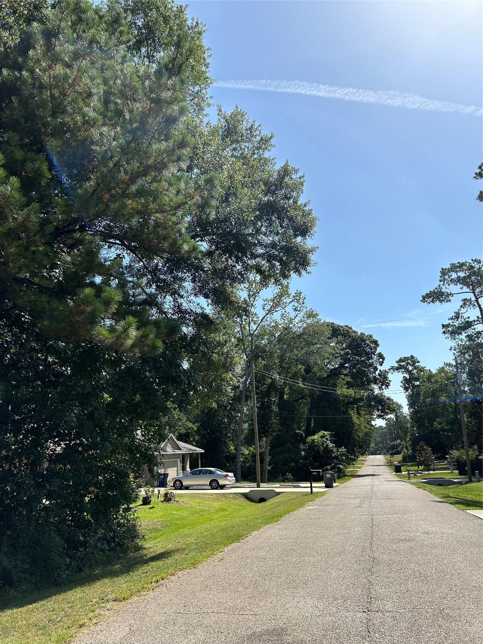 0 Royal Creek Road Conroe, TX 77303 - Photo 20 of 26 Neighborhood street of Royal Forest community.