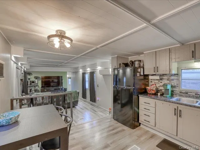 a view of an empty room with a window and balcony