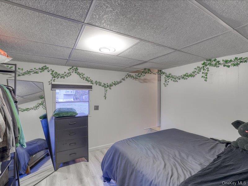 165 Lattintown Road, Unit LOT 60 Newburgh, NY 12550 - Photo 14 of 24 Bedroom with light wood-type flooring and a paneled ceiling