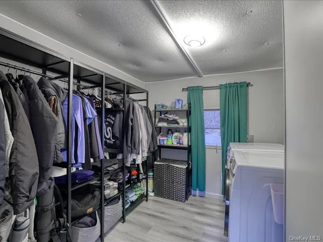 a living room with furniture and a glass door