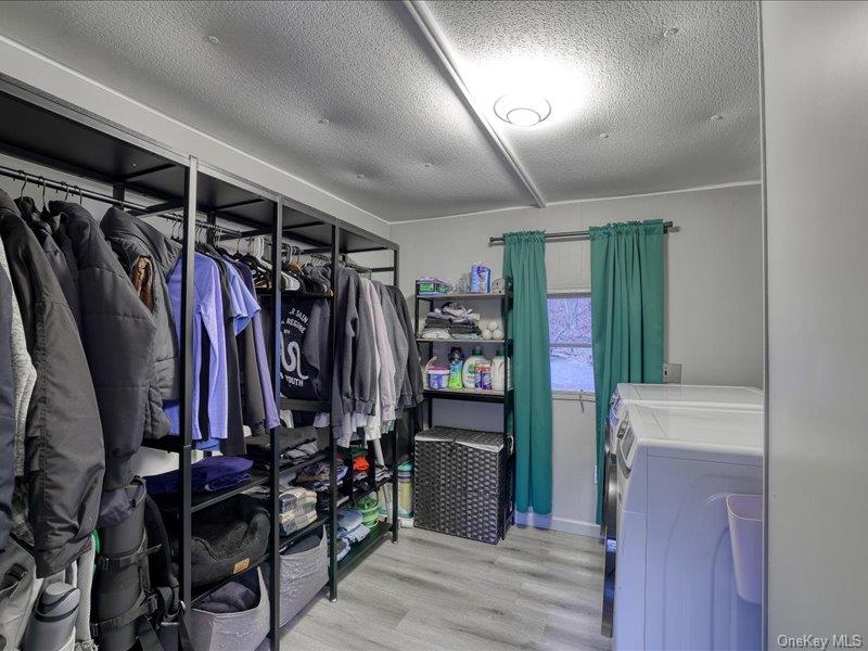 165 Lattintown Road, Unit LOT 60 Newburgh, NY 12550 - Photo 19 of 24 a view of walk in closet with clothes