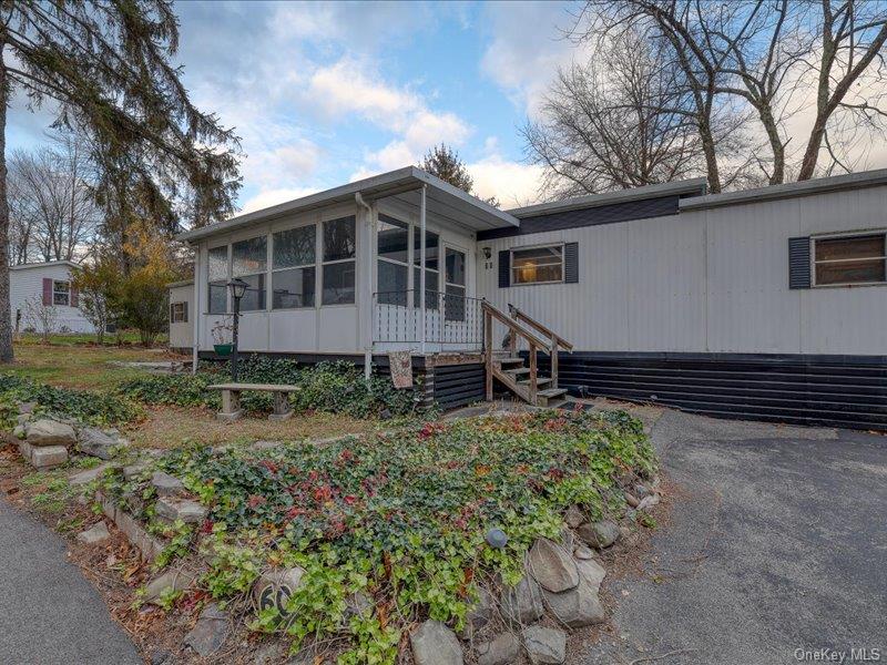 165 Lattintown Road, Unit LOT 60 Newburgh, NY 12550 - Photo 2 of 24 Manufactured / mobile home featuring a sunroom