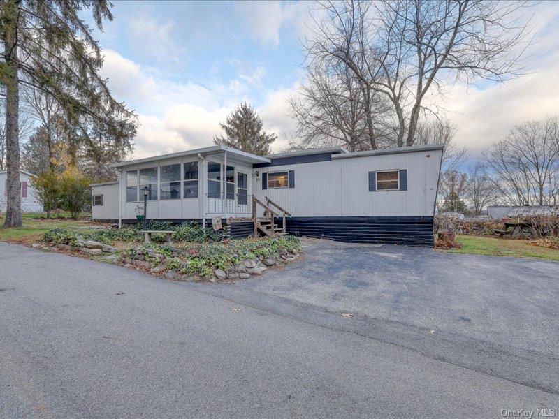 165 Lattintown Road, Unit LOT 60 Newburgh, NY 12550 - Photo 3 of 24 Manufactured / mobile home featuring a sunroom