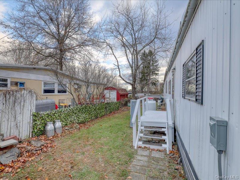 165 Lattintown Road, Unit LOT 60 Newburgh, NY 12550 - Photo 9 of 24 a view of a porch and garden