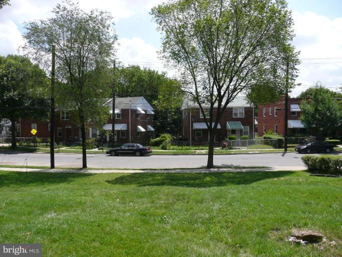 S Street Southeast Washington, DC 20020 - Photo 4 of 8 a park view with a bench and trees