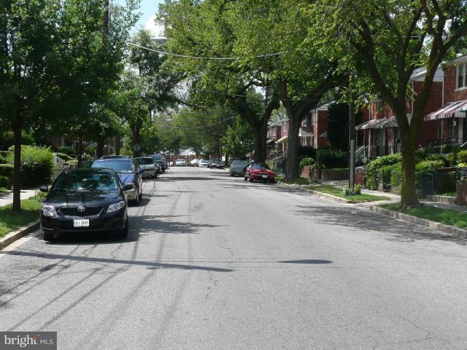 S Street Southeast Washington, DC 20020 - Photo 5 of 8 a view of street with parked cars
