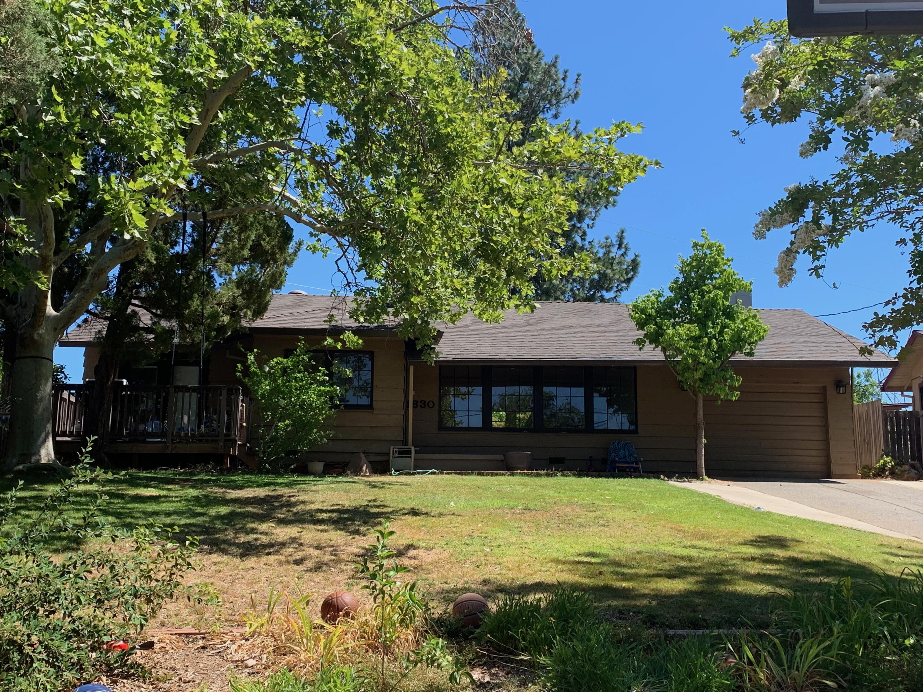 1630 Barbara Road Redding, CA 96003 - Photo 1 of 1 a front view of a house with garden