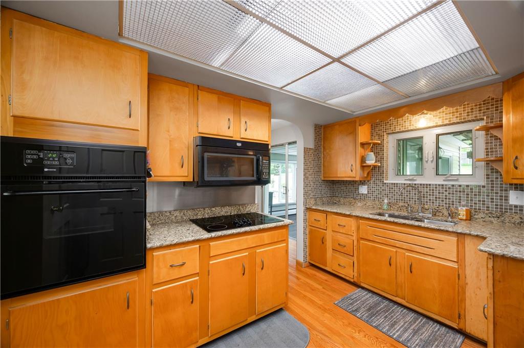 120 West Sunbury Road Butler, PA 16001 - Photo 10 of 46 a kitchen with stainless steel appliances granite countertop sink stove and microwave