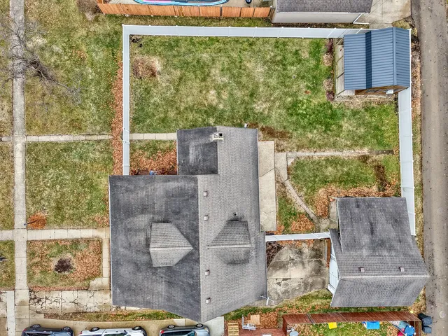 a front view of a house with garden and porch