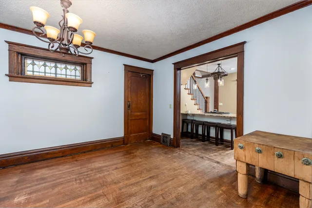 a kitchen with stainless steel appliances white cabinets a stove a sink and a refrigerator