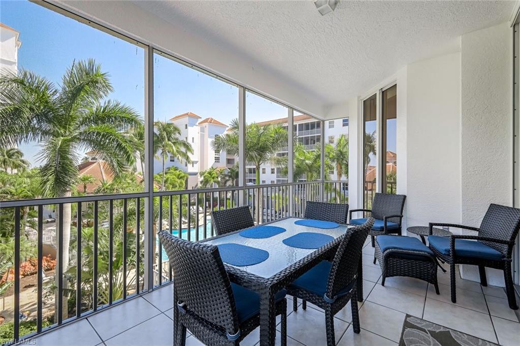 470 Launch Circle, Unit V301 Naples, FL 34108 - Photo 1 of 39 a view of a city from a dining room with furniture window and outside view