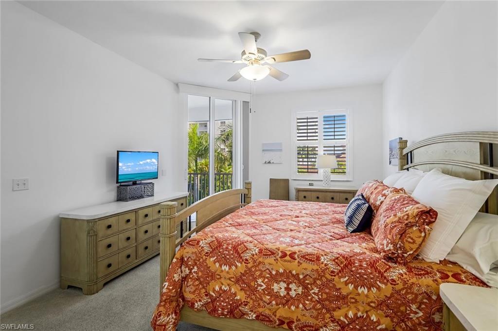 470 Launch Circle, Unit V301 Naples, FL 34108 - Photo 15 of 39 a bedroom with a bed and a window