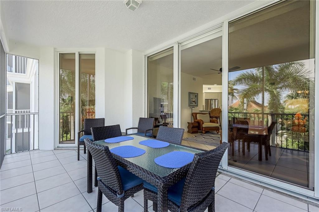 470 Launch Circle, Unit V301 Naples, FL 34108 - Photo 2 of 39 a view of a dining room with furniture window and outside view
