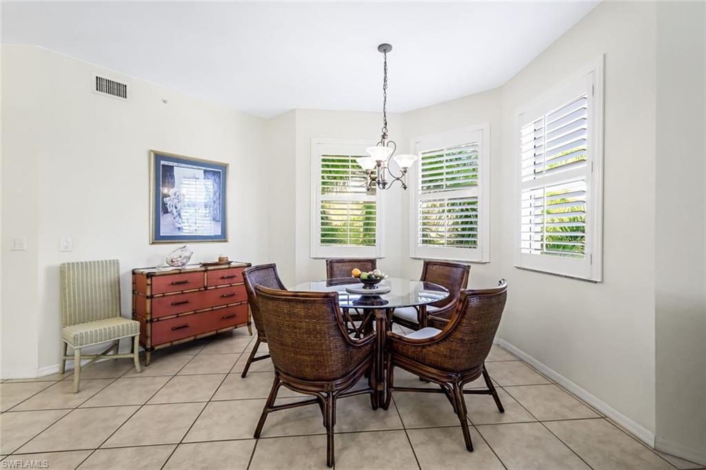 470 Launch Circle, Unit V301 Naples, FL 34108 - Photo 8 of 39 a dining room with furniture and window