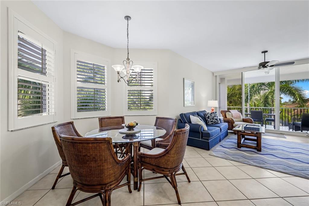 470 Launch Circle, Unit V301 Naples, FL 34108 - Photo 9 of 39 a dining room with furniture and window