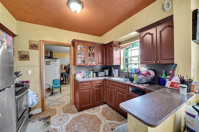 a kitchen with a sink and cabinets