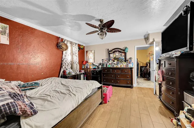 a bed room with a bed and a television