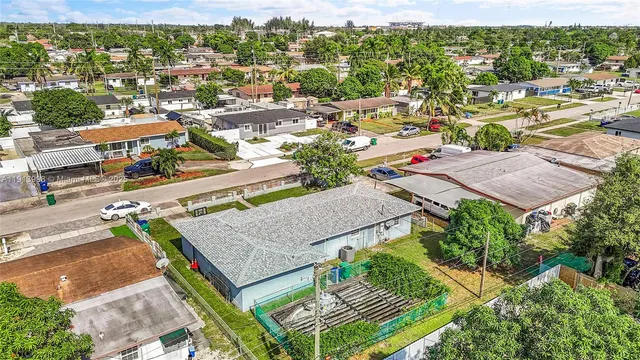 an aerial view of a house with a garden