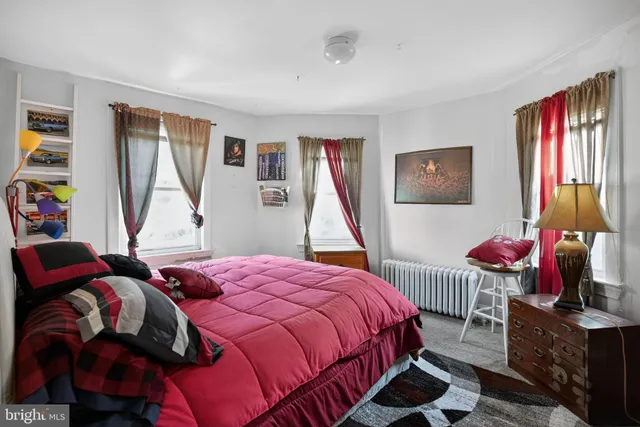 a white bath tub sitting next to a white toilet