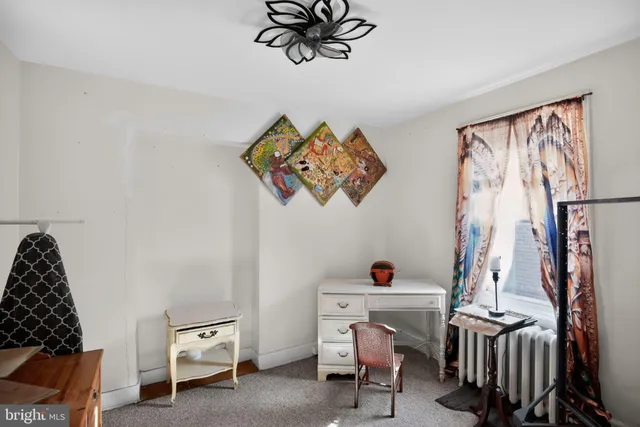 a view of room with guitars and closet