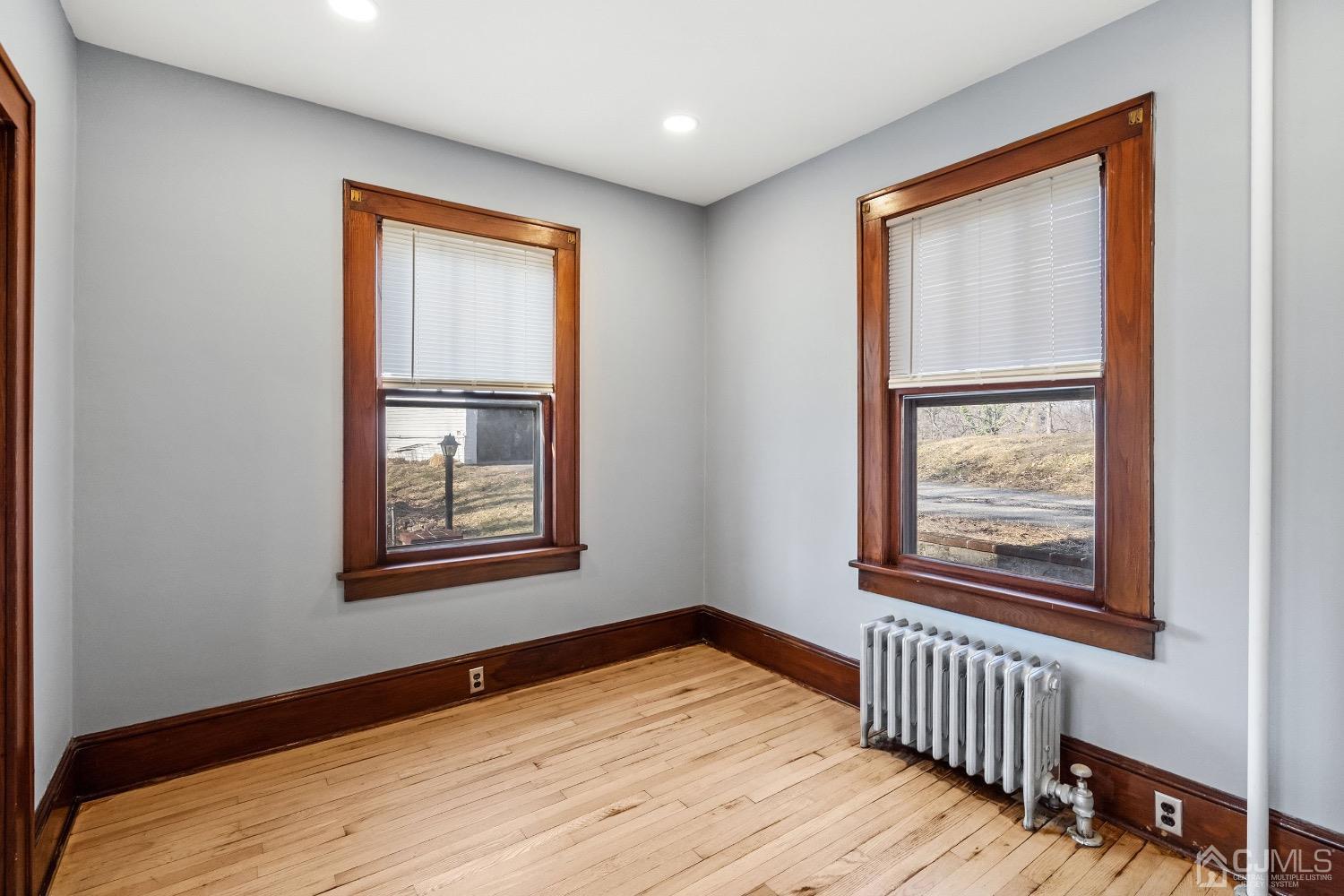 13 Wildcat Road Franklin, NJ 07416 - Photo 21 of 42 a view of an empty room with wooden floor and a window