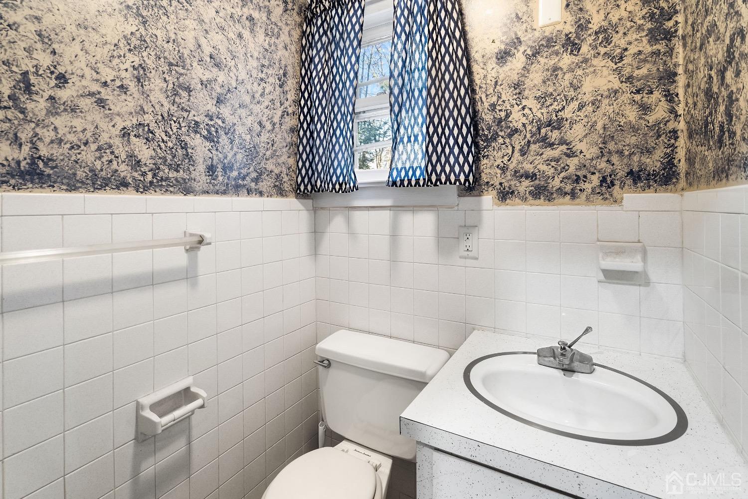 13 Wildcat Road Franklin, NJ 07416 - Photo 23 of 42 a bathroom with a sink mirror and toilet