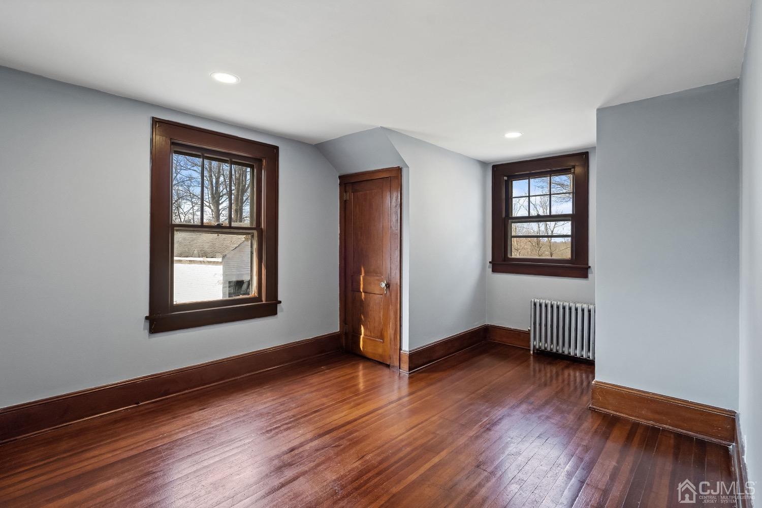 13 Wildcat Road Franklin, NJ 07416 - Photo 25 of 42 an empty room with wooden floor and windows