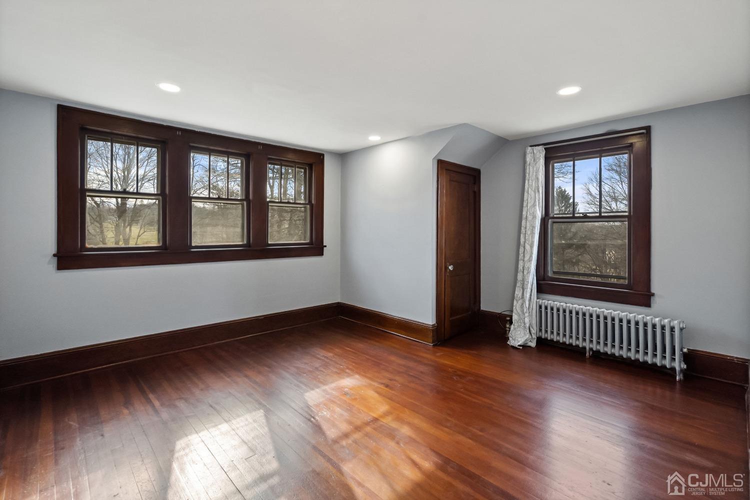 13 Wildcat Road Franklin, NJ 07416 - Photo 28 of 42 an empty room with wooden floor and windows