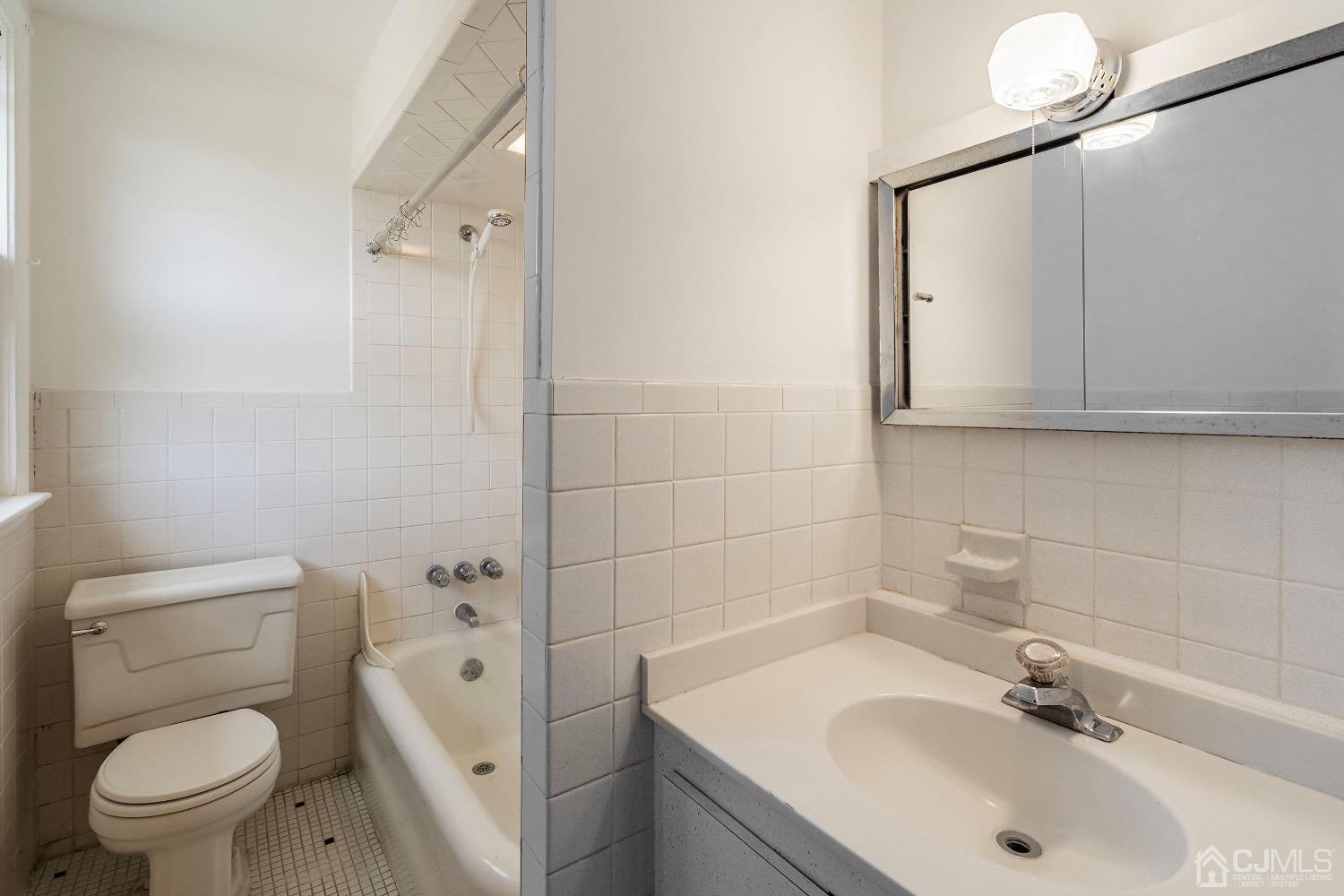 13 Wildcat Road Franklin, NJ 07416 - Photo 29 of 42 a bathroom with a sink a toilet and shower