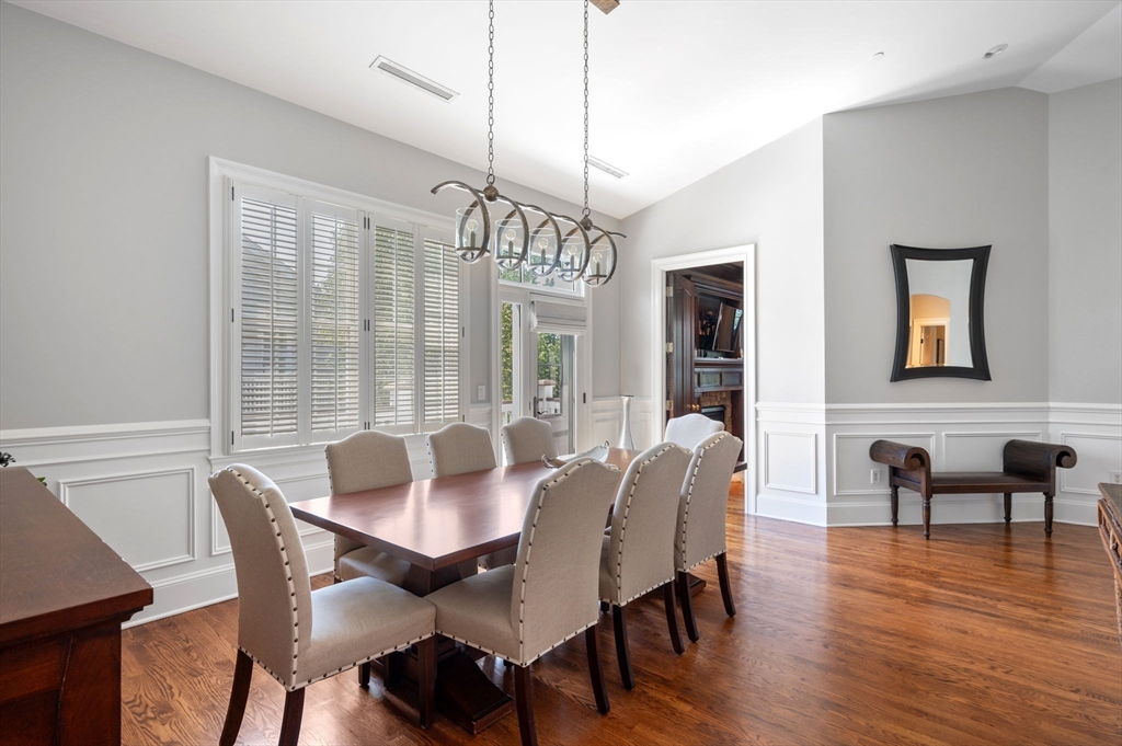 221 Victory Road, Unit 221 Quincy, MA 02171 - Photo 12 of 34 a dining room with furniture window wooden floor