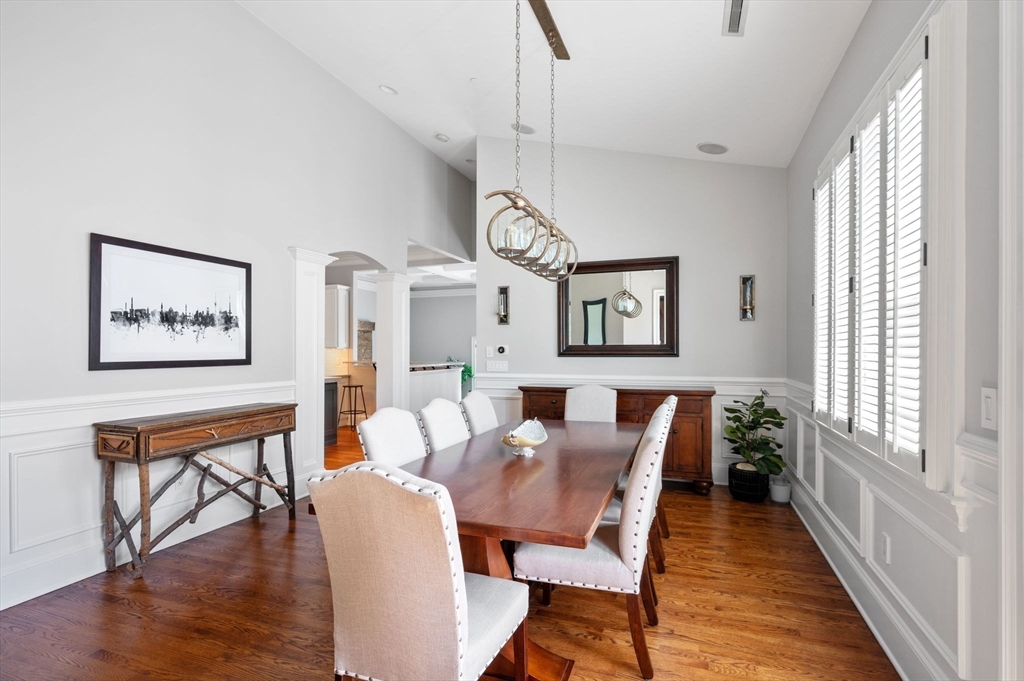 221 Victory Road, Unit 221 Quincy, MA 02171 - Photo 14 of 34 a view of a dining room with furniture window and wooden floor