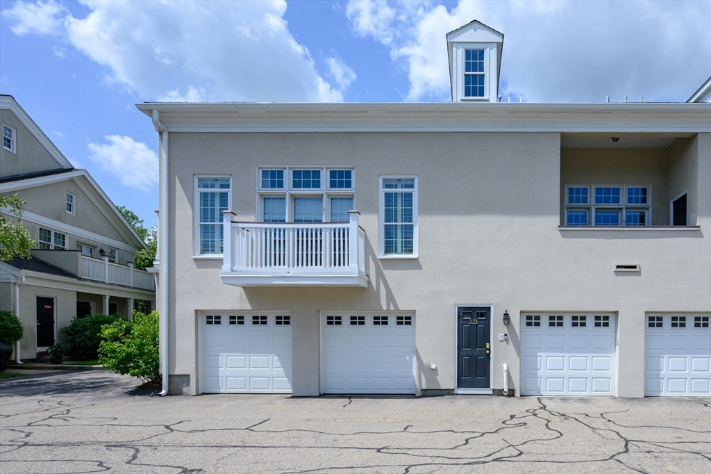 221 Victory Road, Unit 221 Quincy, MA 02171 - Photo 27 of 34 a front view of a building with glass windows and door