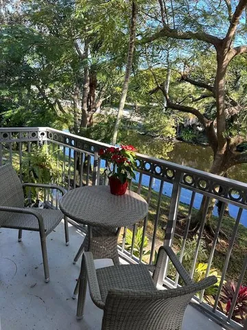 a view of balcony with furniture