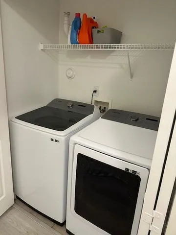 a utility room with dryer and washer