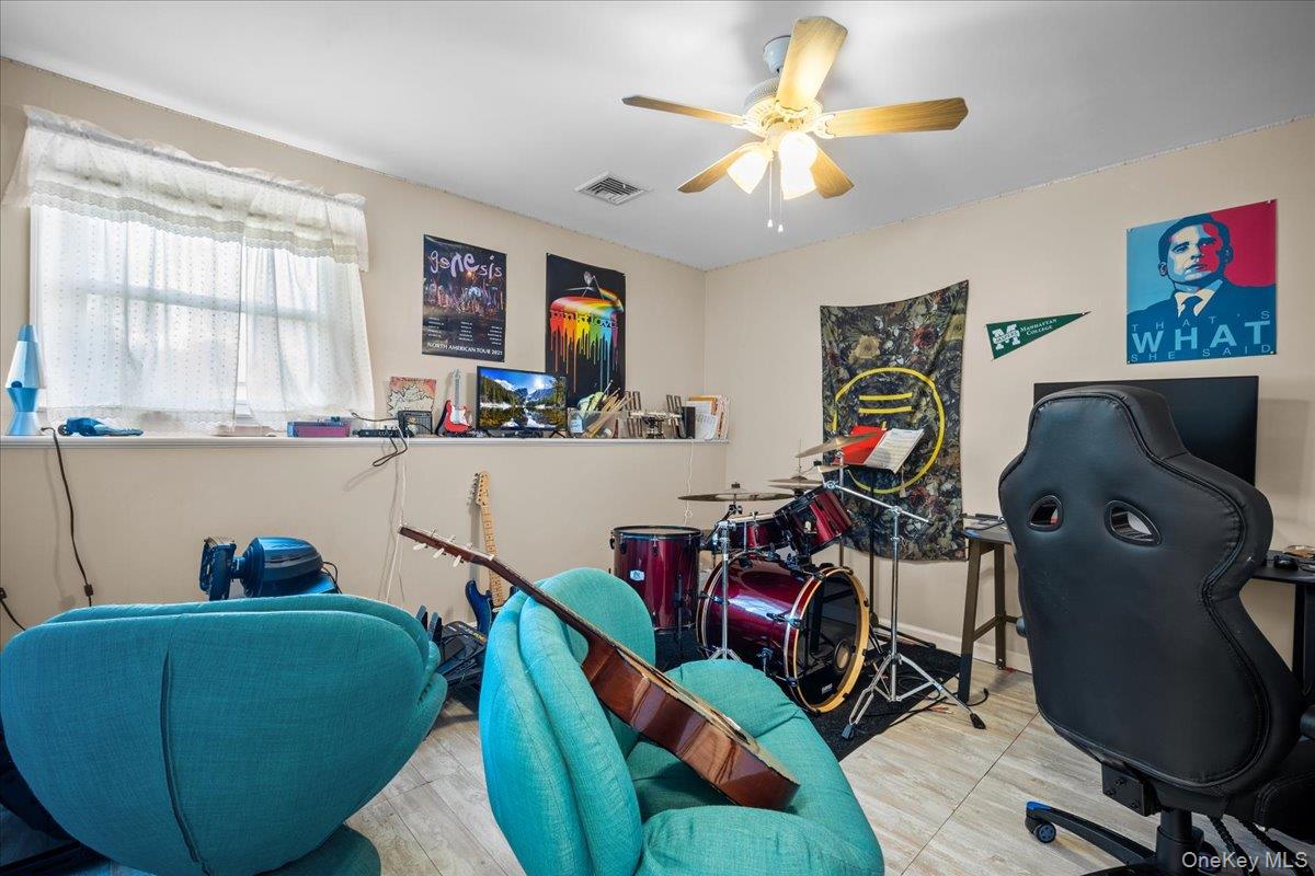 10 Richard Road Mahopac, NY 10541 - Photo 21 of 33 Rec room featuring wood finished floors, an office area, and a ceiling fan