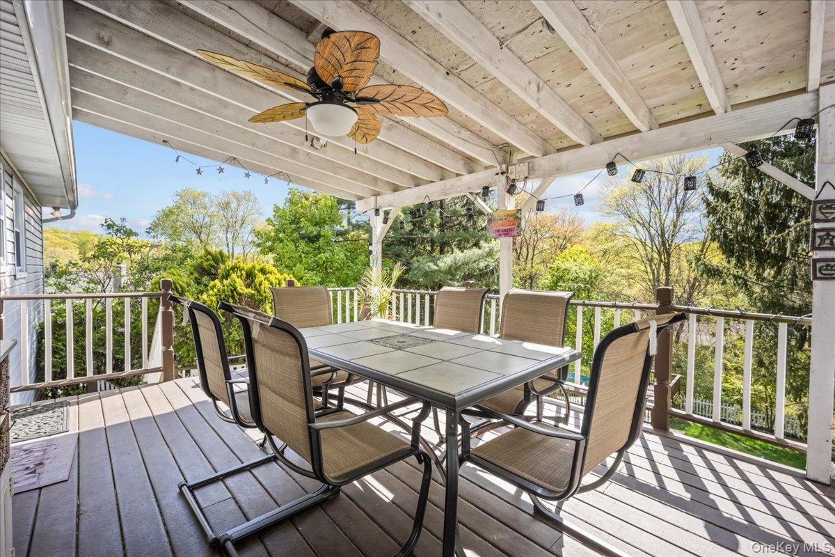 10 Richard Road Mahopac, NY 10541 - Photo 24 of 33 Wooden deck featuring a ceiling fan and outdoor dining area