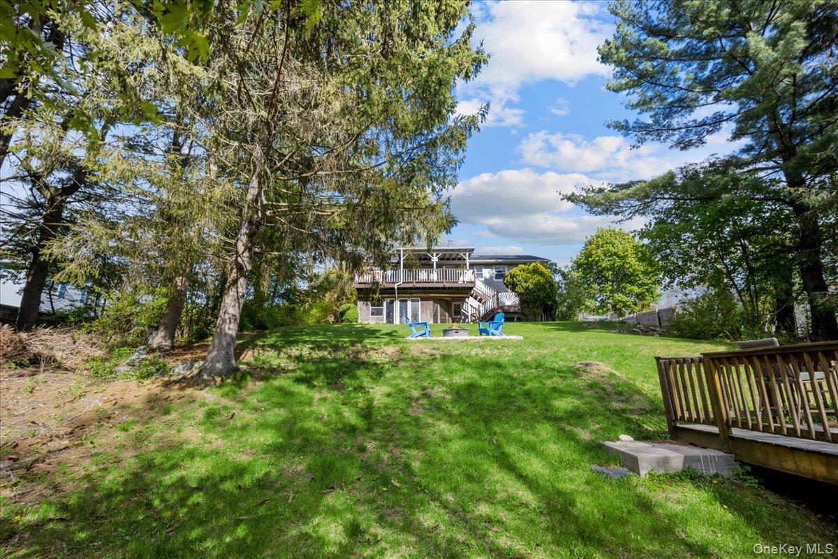 10 Richard Road Mahopac, NY 10541 - Photo 28 of 33 View of green lawn with stairs and a deck