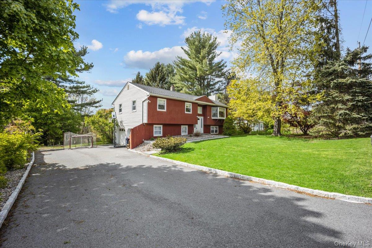 10 Richard Road Mahopac, NY 10541 - Photo 31 of 33 Split foyer home with driveway, a front lawn, and an attached garage