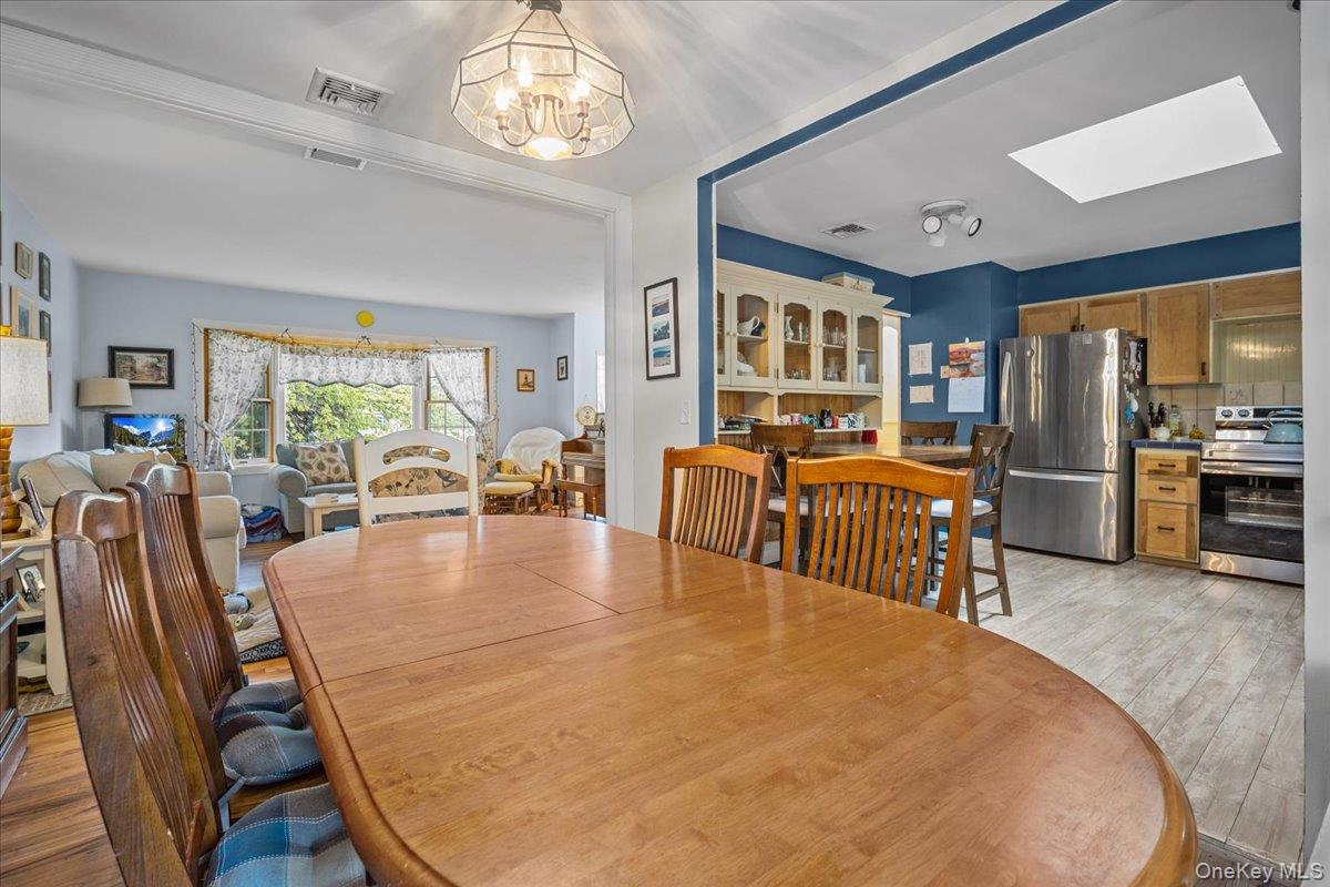 10 Richard Road Mahopac, NY 10541 - Photo 7 of 33 Dining area featuring light wood finished floors and a skylight