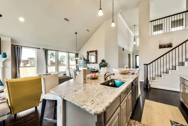 a view of a house with backyard and a patio