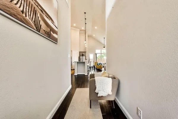 a view of a hallway with seating area